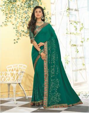 Add This New Shade To Your Wardrobe With This Saree In Teal Green Color Paired With Teal Green Colored Blouse. This Saree IS Georgette Based Paired With Satin Fabricated Blouse. 