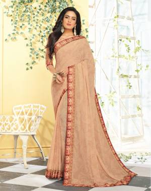 Simple and Elegant Looking Printed Saree Is Here In Light Beige Color Paired With Light Beige Colored Blouse. This Saree Is Georgette Based Paired With Satin Fabricated Blouse. It Is Light In Weight And Easy To Carry All Day Long. 