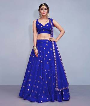 Grab This Designer Readymade Lehenga Choli For The Upcoming Wedding Season. This Lehenga Choli Is In Royal Blue Fabricated On Art Silk Paired With Royal Blue Colored Net Fabricated Dupatta. It Is Beautified With Attractive Mirror Work. Buy Now.