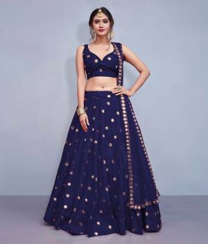 Grab This Designer Readymade Lehenga Choli For The Upcoming Wedding Season. This Lehenga Choli Is In Navy Blue Fabricated On Art Silk Paired With Navy Blue Colored Net Fabricated Dupatta. It Is Beautified With Attractive Mirror Work. Buy Now.