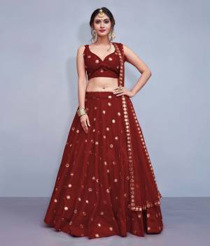Grab This Designer Readymade Lehenga Choli For The Upcoming Wedding Season. This Lehenga Choli Is In Maroon Fabricated On Art Silk Paired With Maroon Colored Net Fabricated Dupatta. It Is Beautified With Attractive Mirror Work. Buy Now.
