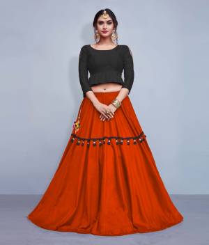 This Festive Season, Look The Most Unqiue And Trendy With This Designer Readymade Lehenga Choli In Black Colored Blouse Paired With Contrasting Orange Colored Lehenga. Its Blouse Is Silk Based With Cotton Fabricated Lehenga. It IS Beautified With Multi Colored Tassels And Lace. 