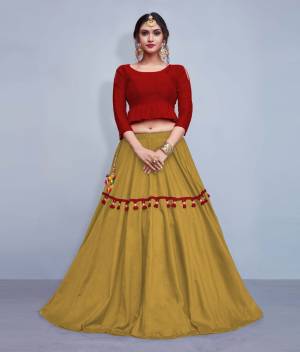 This Festive Season, Look The Most Unqiue And Trendy With This Designer Readymade Lehenga Choli In Maroon Colored Blouse Paired With Contrasting Beige Colored Lehenga. Its Blouse Is Silk Based With Cotton Fabricated Lehenga. It IS Beautified With Multi Colored Tassels And Lace. 
