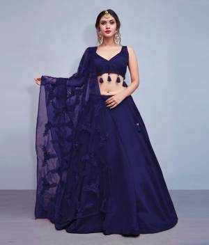 Earn Lots Of Compliments Wearing This Designer Lehenga Choli In Navy Blue Color Paired With Navy Blue Colored Dupatta. Its Blouse And Lehenga Are Silk Based Paired With Heavy Embroidered Net Fabricated Dupatta. Also Its Blouse Is Beautified With Tassels Giving It A Lovely Sleek Look.