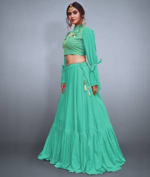 Get Ready For the Upcoming Festive And Wedding Season With This Designer Lehenga And Choli In Sea Green. It Is Fabricated On Crepe Silk With Heavy Embroidered Blouse And Pattern Play. 