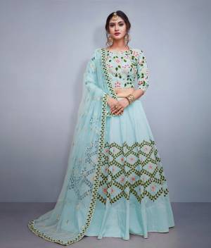 Look The Most Prettiest Of All Wearing This Heavy designer Lehenga Choli In Aqua Blue Color. Its Blouse And Lehenga Are Silk Based Paired With Net Fabricated Dupatta. Also It IS Beautified With Heavy Embroidery All Over. 