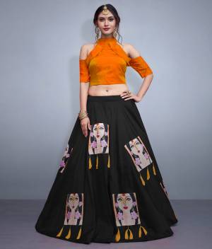 Here Is A Lovely Patterned Designer Lehenga Choli For Festive, Marriage Or Any Occasion Wear. Its Blouse Is In Orange Color Paired With Contrasting Black Lehenga. Its Blouse IS Fabricated On Nylon Silk Paired With Art Silk Lehenga. It IS Beautified with Patch Work And Tassels. 