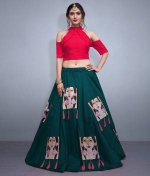 Here Is A Lovely Patterned Designer Lehenga Choli For Festive, Marriage Or Any Occasion Wear. Its Blouse Is In Dark Pink Color Paired With Contrasting Pine Green Lehenga. Its Blouse IS Fabricated On Nylon Silk Paired With Art Silk Lehenga. It IS Beautified with Patch Work And Tassels. 