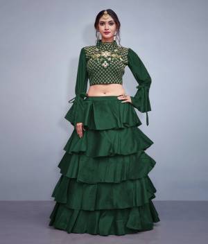 Get Ready For the Upcoming Festive And Wedding Season With This Designer Lehenga And Choli In Pine Green. It Is Fabricated On Art Silk With Heavy Embroidered Blouse And Pattern Play. 