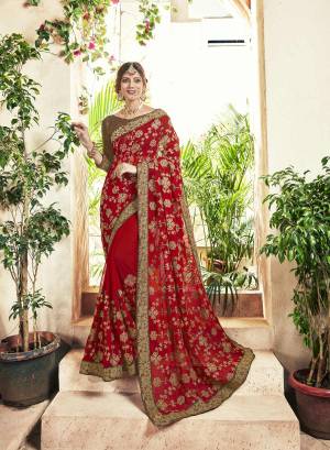 Adorn the Pretty Angelic Look, Wearing This Heavy Designer Saree In Red Color Paired With Brown Colored Blouse. This Saree IS Georgette Based With Heavy Embroidery Paired With Art Silk Fabricated Blouse. 