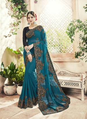 Add This Pretty Shade To Your Wardrobe With this Heavy Designer Saree In Blue Color Paired With Black Colored Blouse. This Saree Is Georgette Based Beautified With Heavy Embroidery Work Paired With Art silk fabricated Blouse. 