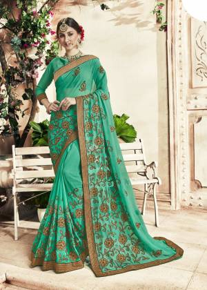 Add This Pretty Shade To Your Wardrobe With this Heavy Designer Saree In Sea Green Color Paired With Sea Green Colored Blouse. This Saree Is Georgette Based Beautified With Heavy Embroidery Work Paired With Art silk fabricated Blouse. 