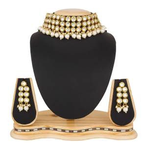 Give An Enhanced Look, Even To Your Simple Traditional Attire With This Beautiful Set Of Necklace In Golden Color. It Is Light In Weight And Can Be Carried Comfortably Throughout The Gala. Buy Now.