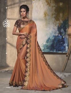 The neutral, earthy tone with a natural sheen makes this saree a wonderful pick for a subtle event. Go for sleek hairdo to look classy. 