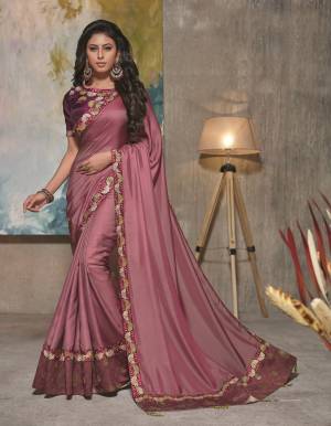 There's a unique aura to conventional pieces with unmistakably contemporary outlook. This royal Mauve saree with a slight sheen will prove to be a best companion this wedding season.