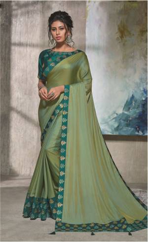 A decent combination of grace and style , this Olive green dual tone saree is a perfect pick for any festive occasion. Add beautiful chandbalis to uplift your look. 