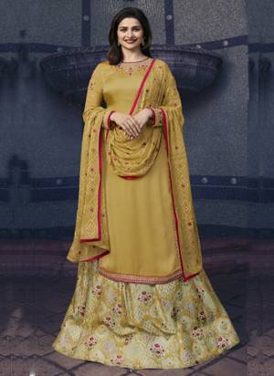 Celebrate This Festive Season Wearing This Designer Indo Western Suit In Yellow Colored Straight Cut Top Paired With Cream Ad Yellow Lehenga And Yellow Dupatta. Its Top Is Satin Georgette Based Paired With Art Silk Lehenga And Chiffon Dupatta. 