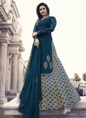 You Will Definitely Earn Lots Of Compliments Wearing This Designer Indo-Western Suit In Blue Colored Top And Dupatta Paired With Cream And Blue Colored Bottom. Its Top Is Fabricated Satin Georgette Paired With Art Silk Lehenga And Chiffon Dupatta. 