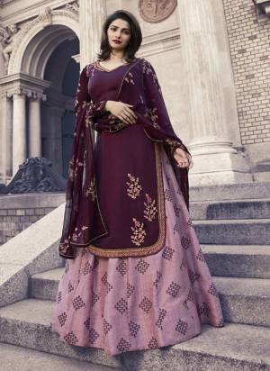 Attract All Wearing This Designer Indo Western Suit In Wine Colored Top Paired With Light Purple Colored Bottom And dupatta. Its Top Is Fabricated On Satin Georgette paired With Art Silk Bottom And Chiffon Dupatta. All Its Fabrics Ensures Superb Comfort All Day Long. 