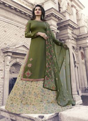 New Shade Is Here To Add Into Your Wardrobe With This Designer Suit In Oluve Green Colored Top And Bottom Paired With Pastel Green Bottom. Its Top IS Satin Georgette Paired With Art Silk Bottom And Chiffon Dupatta. Buy Now.