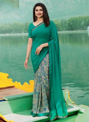 A Very Shade Is Here With This Georgette Based Saree In Turquoise Blue And Grey Paired With Turquoise Blue Colored Art Silk Fabricated Blouse. It Is Beautified With Prints And Embroidered Alce Border. 