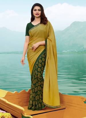 Go With This Shades Of Green With This Lovely Georgette Based Saree In Pear Green And Dark Green Color Paired With Dark Green Colored Blouse. This Saree Is Fabricated On Georgette Paired With Art Silk Fabricated Blouse. Buy This Now.