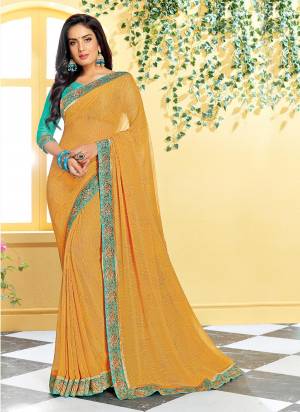 For Festive Feels, Grab This Pretty Saree In Yellow Color Paired With Sea Green Colored Blouse. This Saree IS Georgette Based Which Is Light Weight And Lets You Enjoy The Festival To The Fullest. Buy Now.