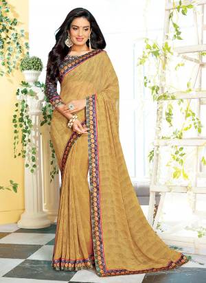 Simple and Elegant Looking Printed Saree Is Here In Beige Color Paired With Dark Blue Colored Blouse. This Saree Is Georgette Based Paired With Satin Fabricated Blouse. It Is Light In Weight And Easy To Carry All Day Long. 