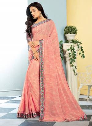 Here Is A Pretty Shade In Blue With This Saree In Light Pink Color Paired With Multi Colored Blouse. This Saree Is Fabricated On Georgette Paired With Satin Fabricated Blouse. Both Its Fabrics Are Soft Towards Skin And Ensures Superb Comfort All Day Long. 
