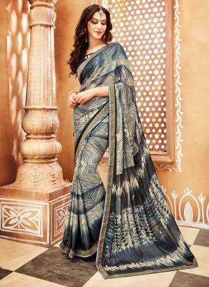 Here Is A Pretty Light Weight Saree Which Ensures You Superb Comfort For Casuals Or Semi-Casuals. This Saree Is Fabricated On Chiffon Georgette Paired With Soft Silk Fabricated Blouse. It Is Beautified with Prints All Over. 