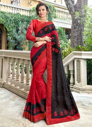 Adorn The Pretty Angelic Look Wearing This Heavy Designer Saree In Red And Black Color Paired With Black Colored Blouse. This Saree Is Silk Based With Heavy Embroidery Paired With Art Silk fabricated Blouse. 