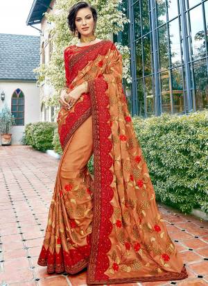 Evergreen Combination Is Here With This Heavy Designer Saree In Brown And Red Color Paired With Red  Colored Blouse. This Saree And Blouse Are Silk Based Beautified With Heavy Embroidery. 