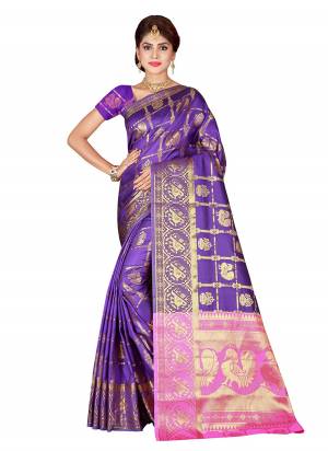Attract All Wearing This Beautiful Silk Based Saree In Purple And Pink Color Paired With Purple Colored Blouse. This Saree And Blouse Are Fabricated Kanjivaram Art Silk Beautified with Weave All Over. 