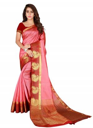 Look Pretty In this Beautiful Color And Most Favourite Of All. This Lovely Pink And Maroon Colored Saree Paired With Maroon Colored Blouse. This Saree And Blouse Are Nylon Silk Fabricated Beautified With Weave, It Also Ensures Superb Comfort All Day Long. 