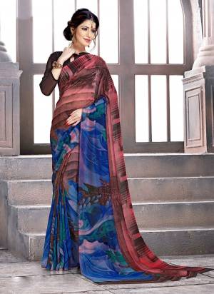 Add This Pretty Saree For Your Casual Or Semi-Casual Wear. This Saree and Blouse Are Fabricated On Georgette Beautified With Prints all Over It. 