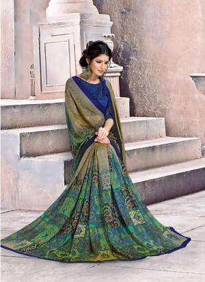 Have A Simple And Smart look With This Lovely Printed Saree Fabricated On Georgette. Its Fabric Is Soft Towards Skin And Ensures Superb Comfort All Day Long. 