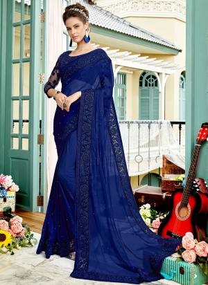 Bright And Visually Appealing Color Is Here To Attract All With This Heavy Designer Saree In Royal Blue Color Paired With Royal Blue Colored Blouse. This Saree Is Fabricated On Chiffon Paired With Net And Art Silk Fabricated Blouse. Buy Now.