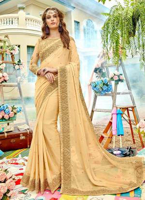Simple And Elegant Looking Designer Saree Is Here In Beige Color Paired With Beige Colored Blouse. This Saree Is Chiffon Based Beautified With Heavy Embroidery Paired With Net And Art Silk Blouse. Buy Now.