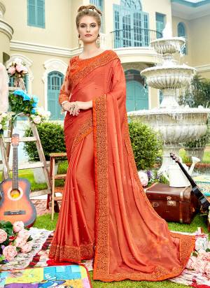 Celebrate This Festive Season Wearing This Pretty Orange Colored Saree Paired With Orange Colored Blouse. This Saree Is Chiffon Based Paired With Art Net And Art Silk Blouse. 