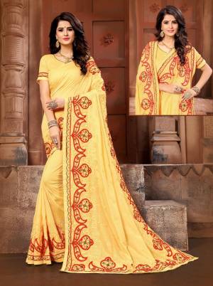 Celebrate This Festive Season With Beauty And Comfort Wearing This Pretty Yellow Colored Saree. This Saree And Blouse Are Silk Beautified With Contrasting Resham Work.