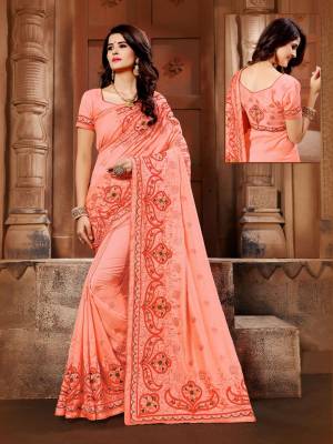 A Must Have Shade In Every Womens Wardrobe Is Here With This Designer Saree In Peach Color Paired With Peach Colored Blouse. This Saree And Blouse Are Silk Based BeautifiedWith Resham Embroidery.