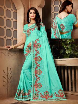 A Must Have Shade In Every Womens Wardrobe Is Here With This Designer Saree In Aqua Blue Color Paired With Aqua Blue Colored Blouse. This Saree And Blouse Are Silk Based BeautifiedWith Resham Embroidery.