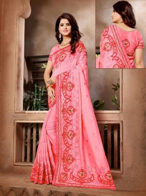 Celebrate This Festive Season With Beauty And Comfort Wearing This Pretty Pink Colored Saree. This Saree And Blouse Are Silk Beautified With Contrasting Resham Work.