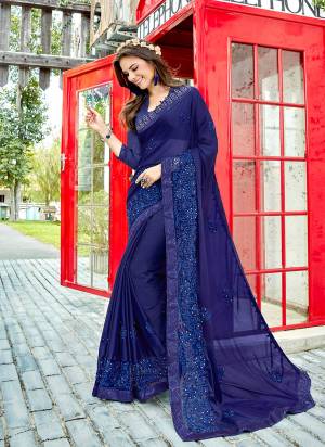Shine Bright In This Lovely Royal Blue Colored Saree Paired With Royal Blue Colored Blouse. This Saree Is Fabricated On Georgette paired With Art silk Fabricated Blouse. It Has Heavy Resham Work With Tone To Tone Shade. 