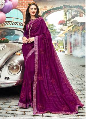 Add This Lovely Shade To Your Wardrobe With This Heavy Designer Saree In Wine Color Paired With Wine Colored Blouse. This Saree And Blouse Are Silk Beautified With Embroidery All Over.