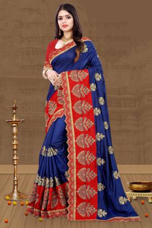 Celebrate This Festive Season Wearing This Beautiful Designer Saree In Royal Blue Color Paired With Contrasting Red Colored Blouse. This Saree And Blouse Are Fabricated On Art Silk Beautified With Heavy Embroidery, Buy Now.