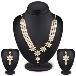 Grab This Very Pretty Designer Necklace Set Beautified With Colored Pearl And Stone Work, This Pretty Set Comes With A Set Of Earrings. Also It Can Be Paired With Any Same Or Contrasting Colored Traditional Attire. 