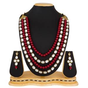 For An Enhanced Look, Grab This Heavy Layered Necklace Set Beautified with Pearl And Stone Work. This Necklace Set Is Best Suitable with A Silk Saree. Also It Can Be Paired With Any Type Of Attire As Per Your Comfort And Matching. Buy Now.