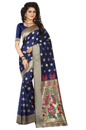 Enhance Your Personality Wearing This Designer Silk Saree In Navy Blue Color Paired With Navy Blue Colored Blouse. This Saree Is Fabricated On Jacquard Silk Paired With Art Silk Blouse Beautified With Weave All Over. 