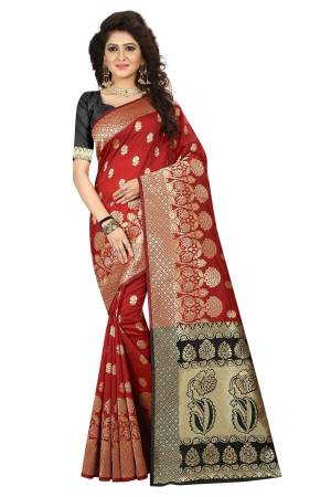 For A Royal Look, Grab This Silk Based Saree In Maroon Color Paired With Black Colored Blouse. Its Rich Color And Rich Jacquard Silk Fabric Will Earn You Lots Of Compliments From Onlookers. 